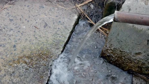 Old rustic drinking water fountain made of steel pipe. Flowing stream of fresh Stock Footage 197014002