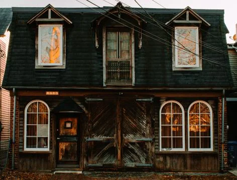 An Old Rustic House Made of Textured Wood With a Barn Door Stock Photos