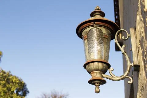 Old Rustic Outside Street Lantern on a Brick Wall Stock Photos