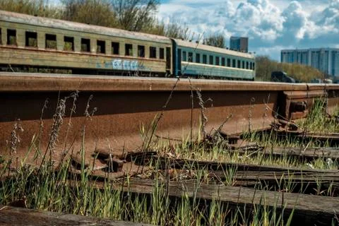 Old rustic railroad track in springtime. Stock Photos