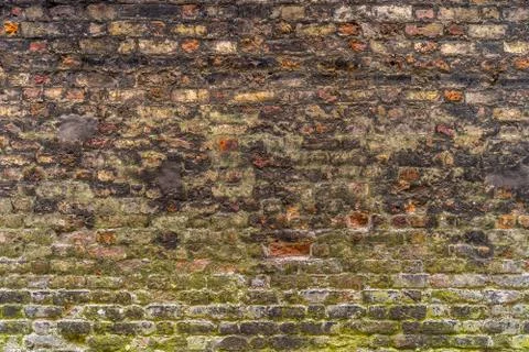 Old, rustic red corroded and damaged brick wall Stock Photos