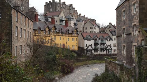 Old rustic riverside buildings, in Dean Village, Edinburgh. Water of Leith Stock Footage 260221821