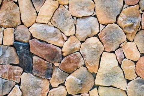 Old rustic rock wall texture Stock Photos
