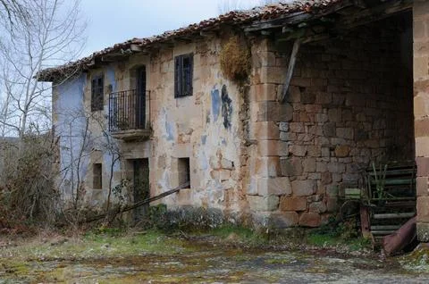 Old, rustic stone building with Spanish architectural charm in Elines 写真素材