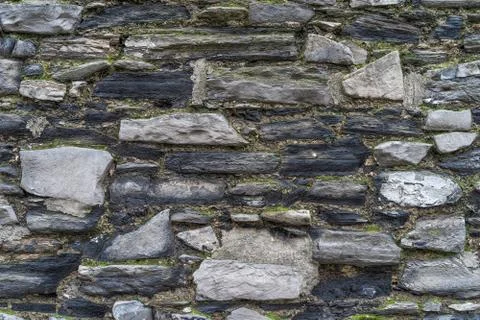 Old rustic stone wall High quality texture and background Stock Photos