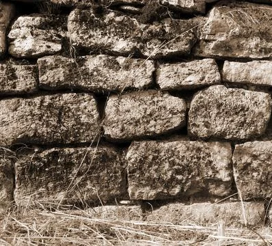 Old Rustic Stone Wall Texture With Natural Weathered Details Stockfoto's