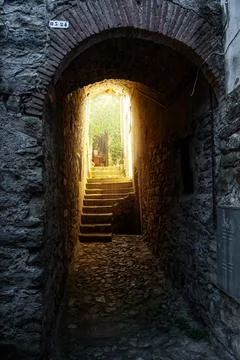 Old rustic tunnel with warm light coming through 写真素材