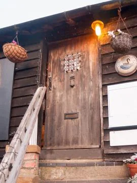 Old rustic unique door outside cafe shack stairs Stock Photos