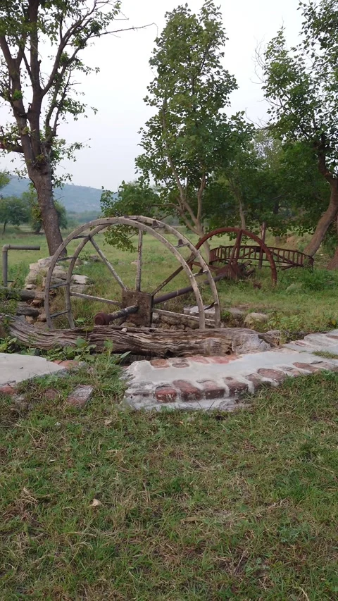 Old Rustic Water Well Wheel In Countryside Landscape - 4k Vertical Footage Video stock 338290678