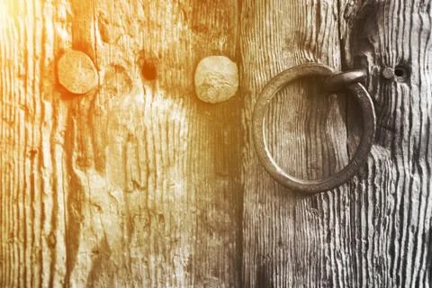 Old rustic wooden door with a ring handle Stock Photos