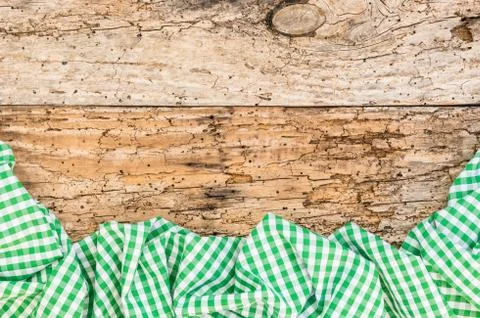Old rustic wooden table background with green tablecloth Stock Photos