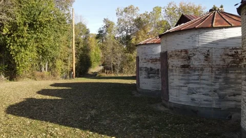 Old rusting farm silos 4K aerial drone autumn Video stock 219755003