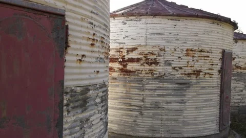 Old rusting grain silos aerial drone rise 4K Stockbeeldmateriaal 219758891