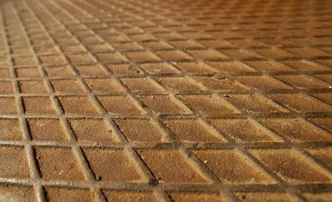 Old rusting metal plate with rectangular matrix on surface Stock Photos