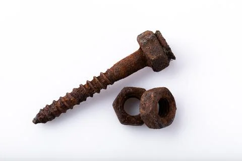 Old rusty aged bolt, not usable, rusty item on white background Stock Photos