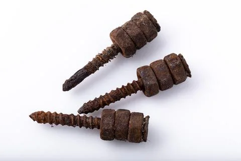 Old rusty aged bolt, not usable, rusty item on white background Stock Photos