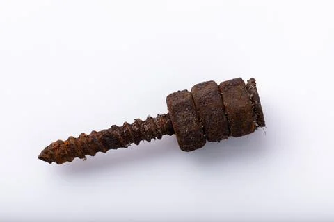 Old rusty aged bolt, not usable, rusty item on white background Stock Photos