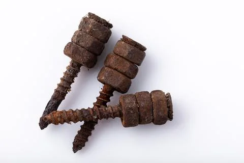 Old rusty aged bolt, not usable, rusty item on white background Stock Photos