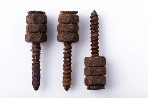 Old rusty aged bolt, not usable, rusty item on white background Stock Photos