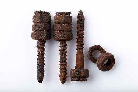 Old rusty aged bolt, not usable, rusty item on white background Stock Photos