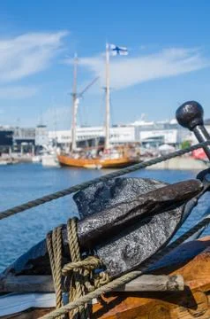 Old rusty anchor at a board of the old sailboat Stock Photos