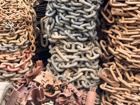 Old rusty anchor chains, large chain wrap, chains for sale at the market Stock Photos