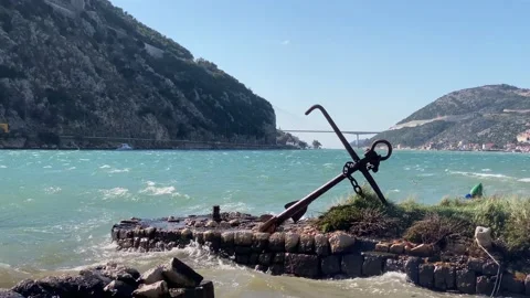 Old rusty anchor on a dock in Dubrovnik, Croatia on a windy day February 2021. Stock Footage 148434230