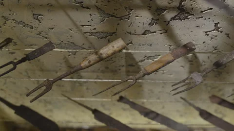 Old rusty ancient objects for eating by ancient people, pan shot. Stock Footage 256810181