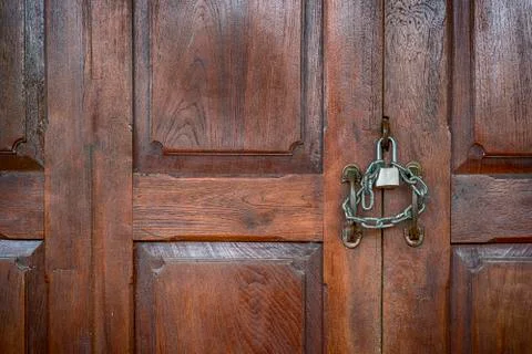 Old rusty and key locks on wooden door Stock Photos