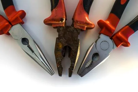 Old Rusty and Two New Pliers Stock Photos