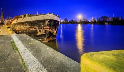 Old rusty barge at night Stock Photos