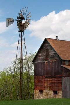 Old rusty barn and windmill Stock Photos