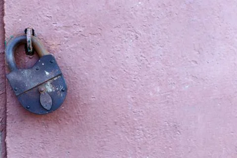 An old rusty barn lock on an iron door Stock Photos