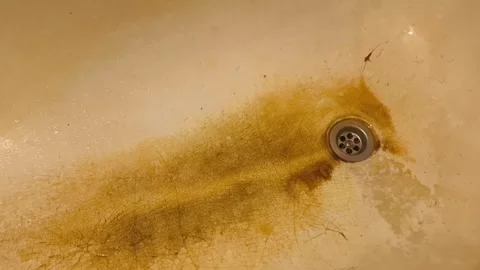 An old rusty bathtub with cracks and yellow spots Stock-Footage 332975151