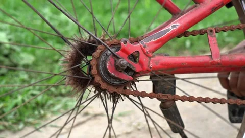 Old Rusty Bicycle Chain and Rear Sprocket Mechanism on Red Bike Frame. Stock Footage 337372869