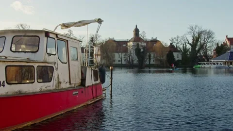 Old Rusty Boat In a German Harbor with Castle in the Background Stock Footage 169475968