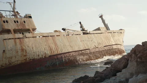Old rusty boat left after crash on seaside Stock Footage 163300180
