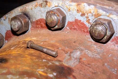 Old rusty bolt and nut on steel background Stock Photos