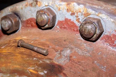 Old rusty bolt and nut on steel background Stockfoto's