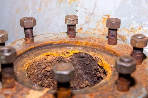 Old rusty bolt and nut on steel background Foto stock