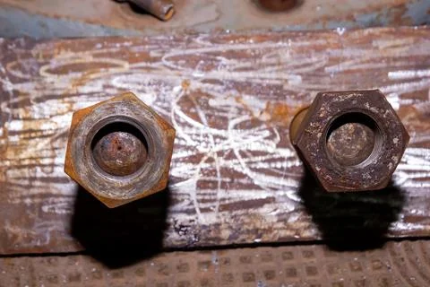 Old rusty bolt and nut on steel background Stock Photos