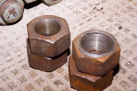 Old rusty bolt and nut on steel background Stock Photos