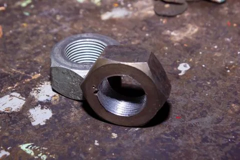 Old rusty bolt and nut on steel background 스톡 사진