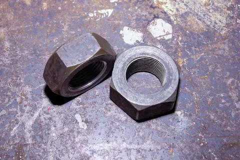Old rusty bolt and nut on steel background Stock Photos