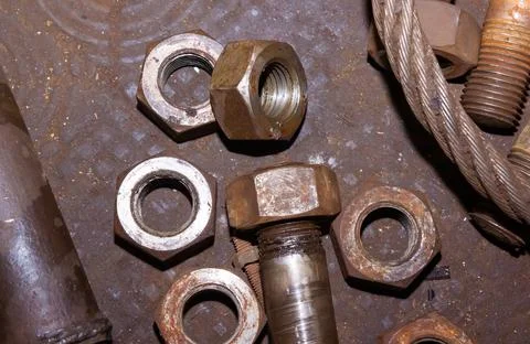 Old rusty bolt and nut on steel background Stock Photos