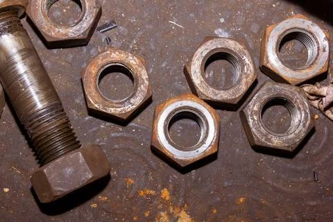 Old rusty bolt and nut on steel background Stock Photos