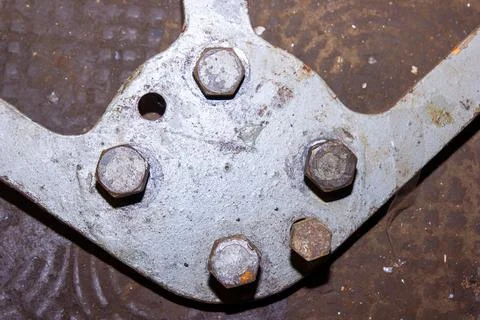 Old rusty bolt and nut on steel background Photos