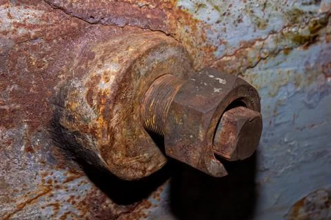 Old rusty bolt and nut on steel background Stock Photos