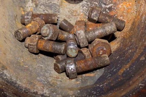 Old rusty bolt and nut on steel background Stock Photos
