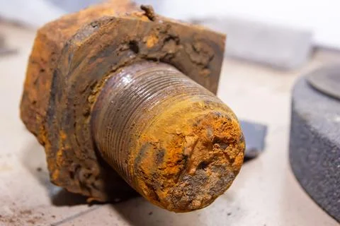 Old rusty bolt and nut on steel background Stock Photos